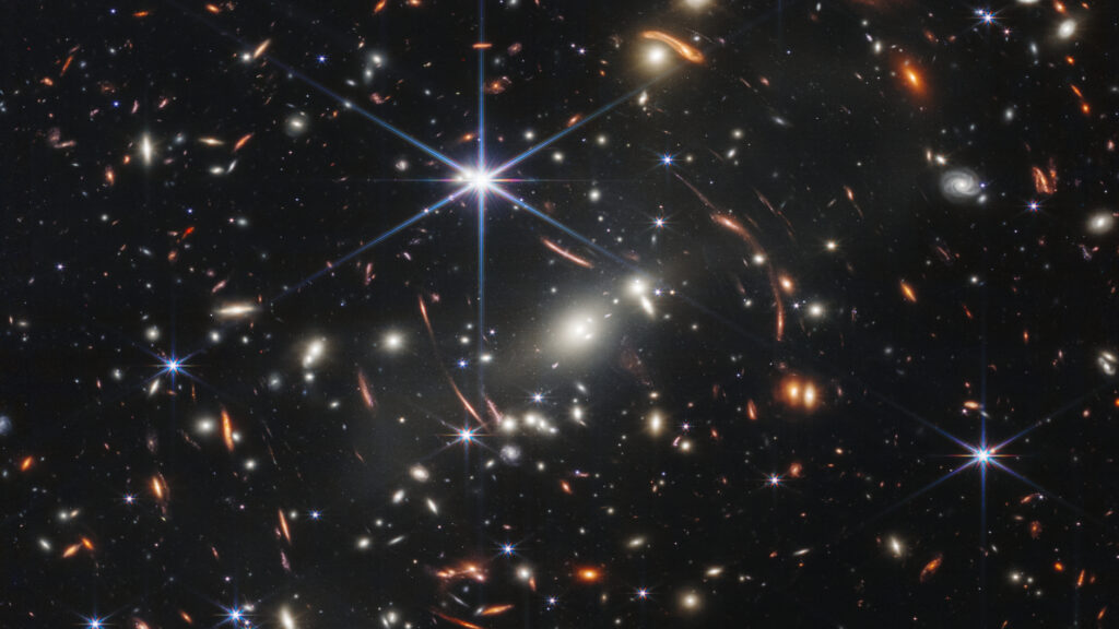 Vast swarms of hidden galaxies may be secretly bathing the universe in a soft glow