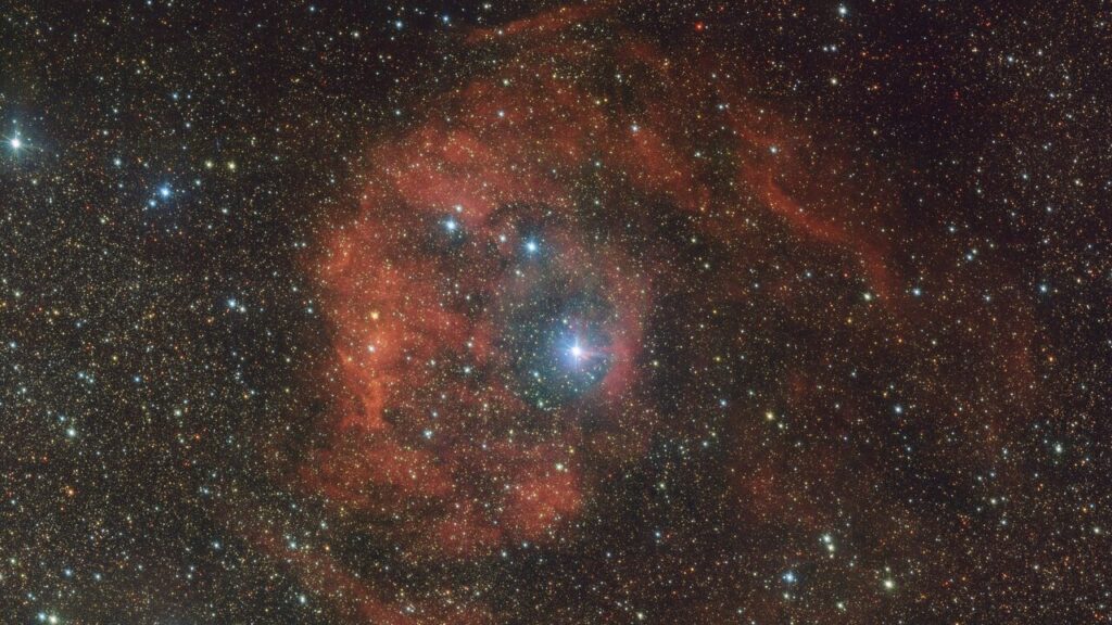 Cosmic imposter bathes distant nebula in fiery red glow: 'This star should not be here'
